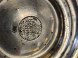 a close up of a metal object with a hole in it