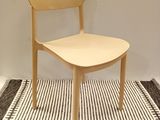 a chair that is sitting on a rug in a room