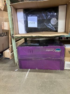 a purple box sitting on top of a shelf in a warehouse