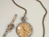 a pocket watch with a chain attached to it