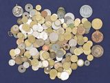 a pile of coins on a blue surface