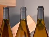 several bottles of wine are lined up on a table