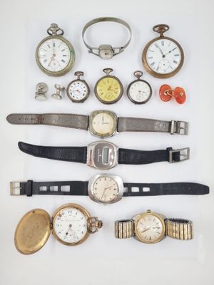 many different types of watches on a white surface