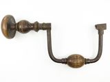 an image of a pair of antique brass door handles on a white wall