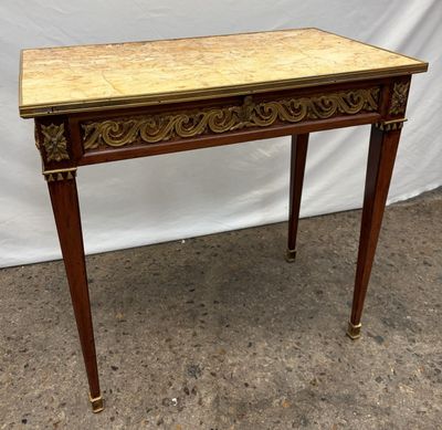 a wooden table with a marble top and legs