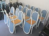 many chairs that are lined up in a room