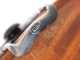a close up of a wooden surfboard with a metal handle