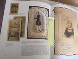 an open book with a picture of a boy in a black coat