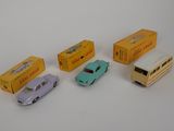 four toy cars that are sitting next to each other