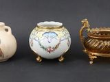 three vases sitting next to each other on a table