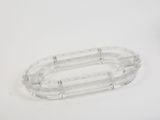 a close up of a clear plastic object on a white surface