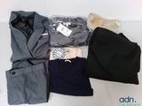 a pile of clothing that is sitting on a table