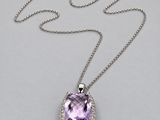an amethorate and diamond pendant on a chain