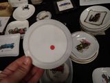a person holding a white plate with a red dot on it