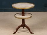 a three tiered table with a marble top