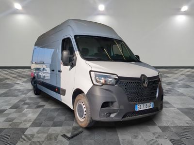 a white van that is parked on a checkered floor