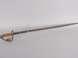 a close up of a sword with a wooden handle on a white surface