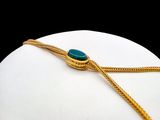 a picture of a necklace with a turquoise stone on it