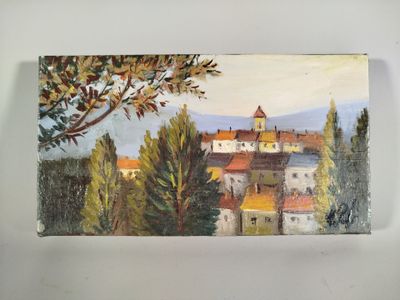 une photo d'un tableau représentant une ville accroché au mur