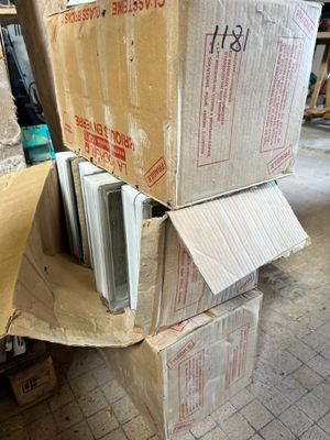 many boxes stacked on top of each other on the floor