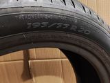 a close up of a tire on a cardboard box with a cardboard box in the background
