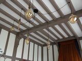 many lights hanging from the ceiling in this living room