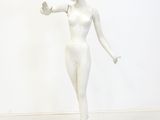 a white statue of a woman standing on a pedestal