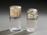 pair of silver and glass salt and pepper shakers on a gray surface