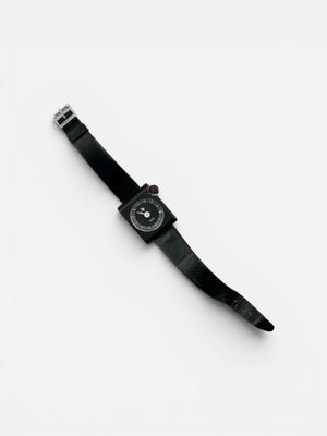 black watch on a white surface with a white background
