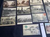 many old black and white photos on display on a table