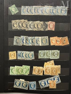many different stamps on display in a glass case