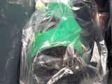 a plastic bag with a green hat on top of it