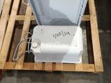 a picture of a white refrigerator sitting on a pallet