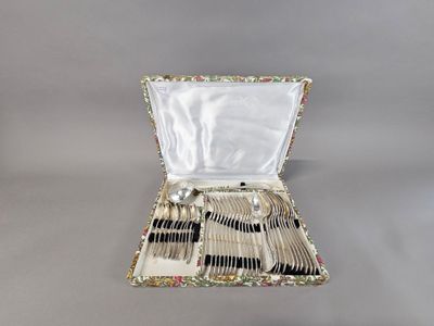 a case with silverware inside of it on a table
