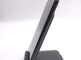 a cell phone that is sitting on a stand