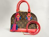 sac à main Louis Vuitton avec dragonne assortie et porte-monnaie assorti