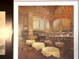 two posters on the wall of a restaurant with a picture of a woman
