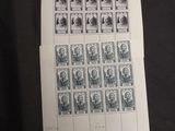 a black and white photo of a sheet of paper with stamps on it