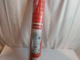 a roll of red fire extinguisant on a white surface