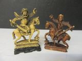 two figurines of a man on a horse and a man on a horse