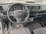 dashboard of a small car with a steering wheel and dashboard controls