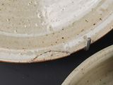 two plates that are sitting on a table