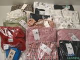 many different types of shirts on display in a box