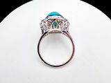 an image of a close up of a ring with a turquoise stone in it