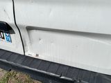 the rear end of a white truck with the word rena painted on it