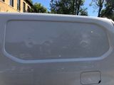 a white van that is parked on the side of the street