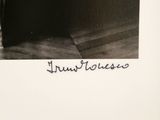 a black and white photo of a chair with a handwritten inscription