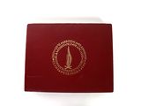 an image of a red box with a gold seal on it