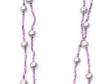 a close up of a necklace on a white background