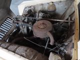 an old car engine with a rusted cover on it